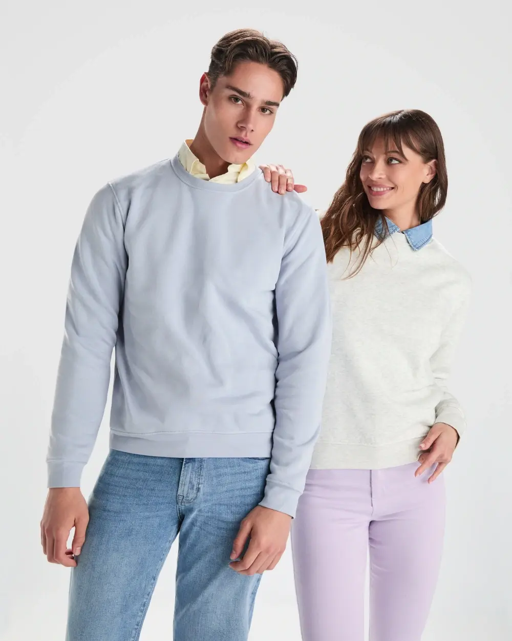 Two people in Roly sweatshirts from the official Casual 2026 collection