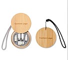 A set of charging cables in a bamboo box, a key ring