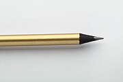 Black wood lead pencil in metallic finish, gold