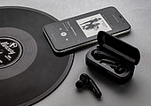 Free Flow TWS earbuds in charging case