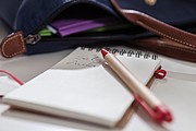 Note book made out of recycled paper/cardboard,colour red