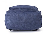 Polyester (300D + 210D) backpack with zippered front pocket.