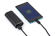 Power bank with two wireless earbuds. The Li-ion battery has a 4000 mAh capacity.