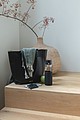 Ukiyo glass hydration tracking bottle with sleeve