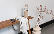Ukiyo glass hydration tracking bottle with sleeve