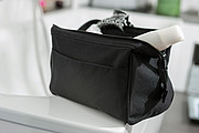 Vanity case main compartment is tightened with a metal holder and zip,colour black