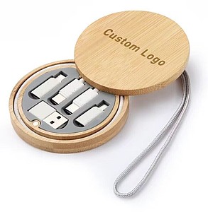 A set of charging cables in a bamboo box, a key ring