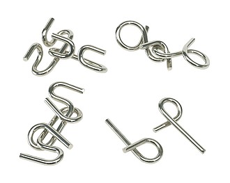 Metal puzzle "Clever conception", 4-times assorted, price per piece,colour silver